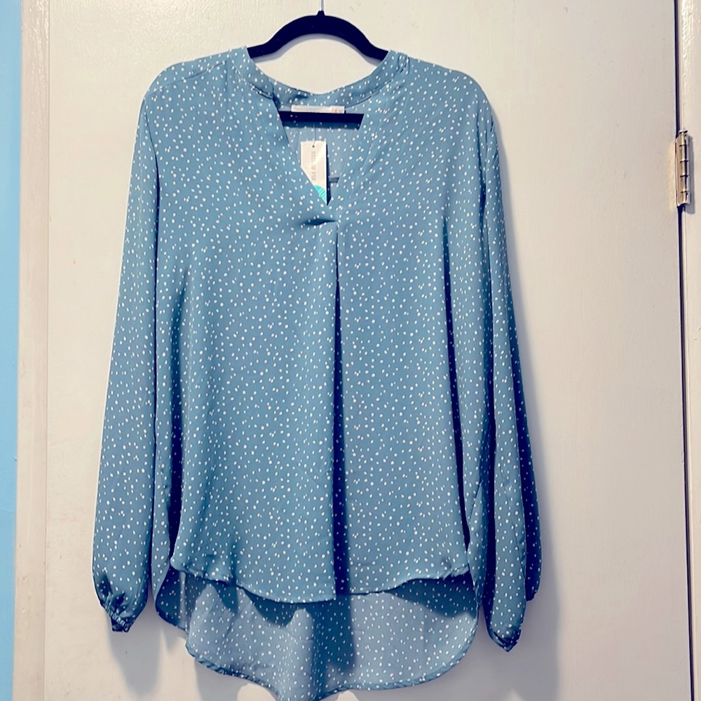 Long sleeve blue and white polkadot blouse with tag still on